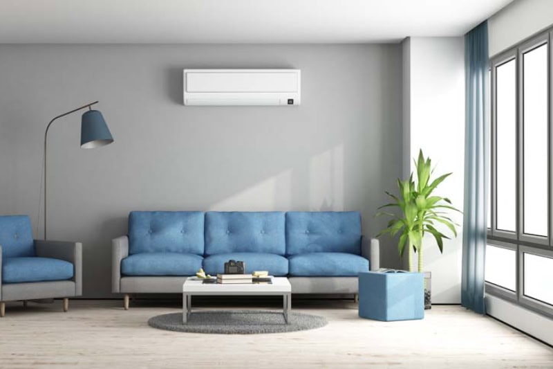 Ductless system mounted to wall, above couch in Wilmington, NC, home.